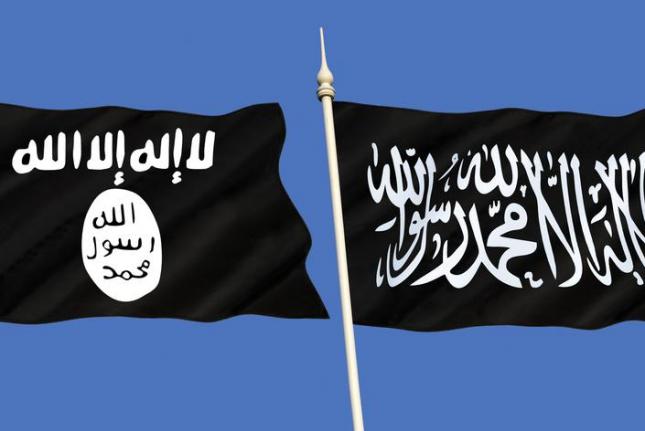 The Islamic State's flag waves left of the Shahada, a flag commonly used by jihadist groups. On March 8, 2015, Australia caught two teens at Sydney airport trying to travel to join the Islamic State -- almost three months after an Islamic extremist took hostages in a cafe in the same city, resulting in a police raid that ended with the deaths of three people, including the gunman. During the siege the gunman forced hostages to hold the Shahada flag in the cafe's window. UPI/Shutterstock/Steve Allen 