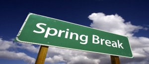 Spring Break Road Sign with Dramatic Clouds and Sky