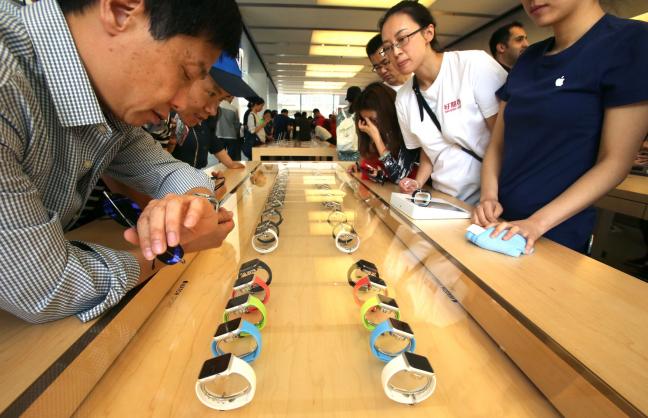 Japanese Apple Watch customers view the product inside a store in Tokyo, Japan. The watch is only physically available in select high-end botiques and department stores worldwide while Apple urges customers to purchase them online instead. Photo by Stephen Shaver/UPI | License Photo