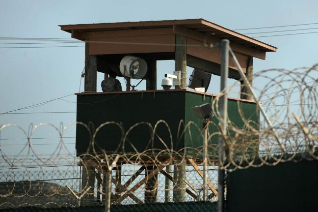 A guard watches over detainees in Camp IV in Camp Delta at Naval Station Guantanamo Bay in Cuba in 2010. File Photo by Roger L. Wollenberg/UPI | License Photo