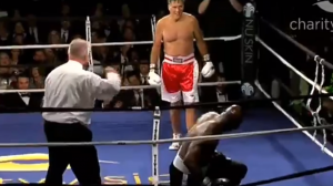 Mitt Romney floors Evander Holyfield during charity boxing match. Photo: Charity Vision