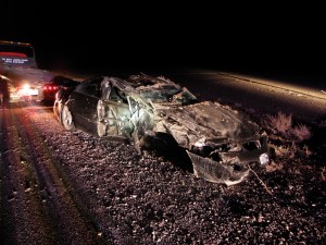 Car Hits Parked Semi Rolls Over in Tooele