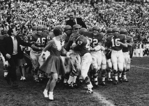 Legendary BYU Coach  Tommy Hudspeth being carried off the field after leading the Cougars to their first Provo win over the University of Utah in 1965. Photo: BYU