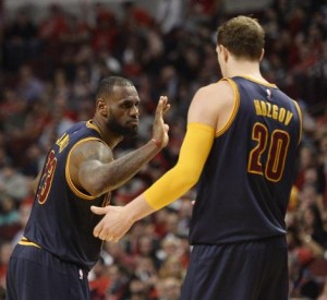 Cleveland Cavaliers forward LeBron James (L) high-fives center Timofey Mozgov during the fourth quarter of game 6 of the Eastern Conference Semifinals of the NBA Playoffs at the United Center on May 14, 2015 in Chicago. The Cavaliers defeated the Bulls 94-73, winning the series 4-2 and advancing the the Eastern Conference Finals. Photo by Brian Kersey/UPI