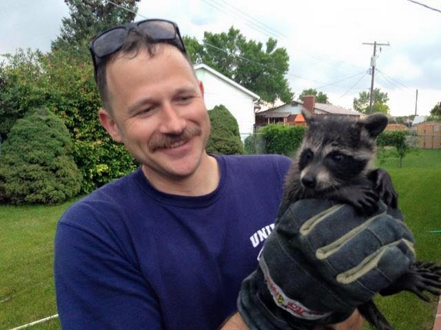 Unified Fire Dept and Baby Raccoon Rescued from Chimney. (Photo Courtesy Unified Fire Dept.)