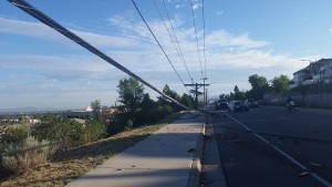 Repair crews attempt to restore electricity after a car downs power poles near 9600 S. 1300 East Tuesday - Photo: Gephardt Daily