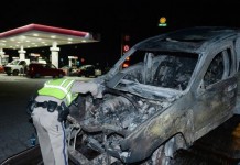 CHP Office Examines Burned Car In San Bernardino Fire