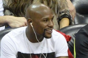 Welterweight boxing champion Floyd Mayweather Jr. watches during the second half of Game 1 in the NBA Eastern Conference Finals between the Atlanta Hawks and the Cleveland Cavaliers at Philips Arena in Atlanta, May 20, 2015. Cleveland won 97-89. Photo by David Tulis/UPI