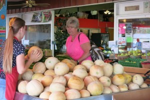 hopper Peggy Molnar came from Evanston, Wy., for Roma tomatoes, but left with a watermelon, cantaloupes and peaches. Photo: Gephardt Daily/Nancy Van Valkenburg