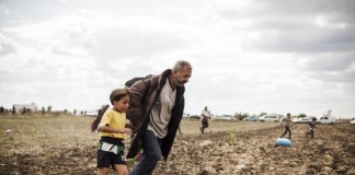 Hungarian Camerawoman Filmed Kicking, Tripping Migrants