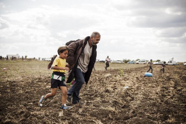 Hungarian Camerawoman Filmed Kicking, Tripping Migrants