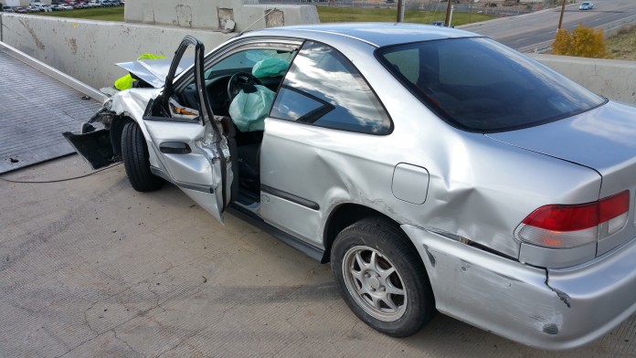 Car Slides Across Four Lanes Of Traffic