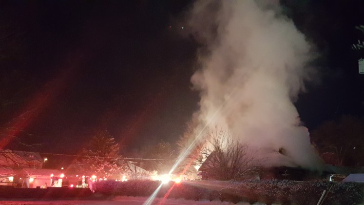 A fast-moving fire was reported at 11 p.m. Dec. 25 at 1880 Sycamore Lane, Holladay. Five engines and two ladder trucks responded to the scene. Photo: Gephardt Daily staff.