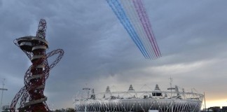 The Royal Air Force aerobatic team, known as the Red Arrows, fly over the Olympic Stadium for the opening ceremony of the 2012 Summer Olympics in London on July 27, 2012. UPI/Brian Kersey
