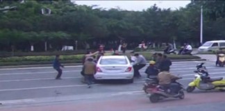 Witnesses Lift Car To Free Cyclist