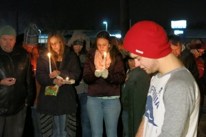 Tre Murphy, in the foreground, spoke Monday night at a vigil for best friend BaiLee DeBernardo, and he offered a prayer on her behalf. Photo: Gephardt Daily