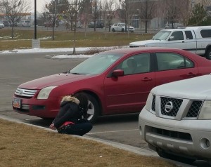 A suspect is arrested after a victim finds his stolen vehicle parked at Taylorsville High School. Photo: Gephardt Daily/Kurt Walter