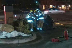 Firefighters from the Unified Fire Authority put out a car fire Monday evening in Cottonwood Heights. Photo: Gephardt Daily