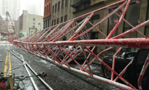 A crane fell on Friday in New York City's financial district, killing one and injuring several others. Photo: UPI
