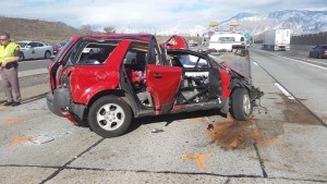 An Ogden woman was in critical condition after hitting the concrete barrier on I-15 Monday afternoon. Photo Courtesy: Utah Highway Patrol