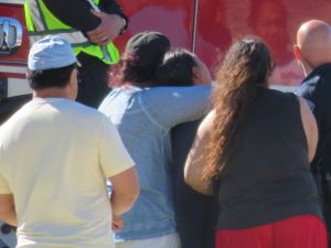 Distraught family members await news of a loved one who drowned during an outing at Blackridge Reservoir in Herriman, Saturday, June 25, 2016. Photo: Gephardt Daily