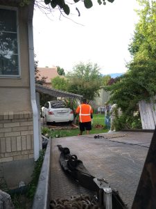 The driver of stolen vehicle crashed into the yard of a home as they were being chased by individuals shooting at them. Photo Courtesy: Unified Police Departmemt