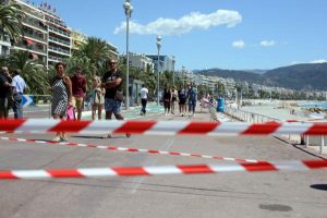 People walk along the Promenade des Anglais open to pedestrians in Nice, Southern France, on Sunday. Eighty-four people were killed and hundreds more injured when a truck mowed down a crowd of revelers attending the Bastille Day fireworks. Photo by Maya Vidon-White/UPI | License Photo 