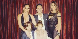 singer later reunited with Anthony backstage to pose for a family photo with their two children, 8-year-old twins Emme and Max. Anthony's wife, Shannon De Lima, joined the foursome for the snapshot