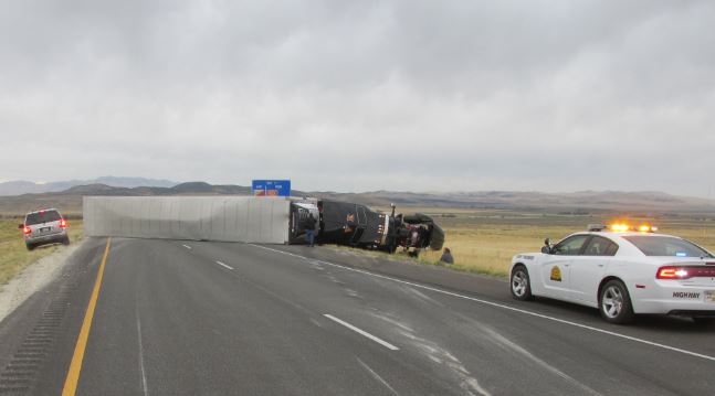A semi hauling frozen food rolled over on I-84 westbound Friday morning causing long delays to drivers. Photo Courtesy: UHP