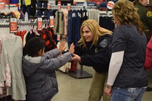 Officers from Unified Police and the Unified Fire Authority help children shop for much needed winter clothing by way of the Unified for Families project. Dec. 17, 2016