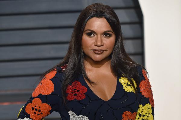 Mindy Kaling flashes her bra on a break from filming The Mindy Project