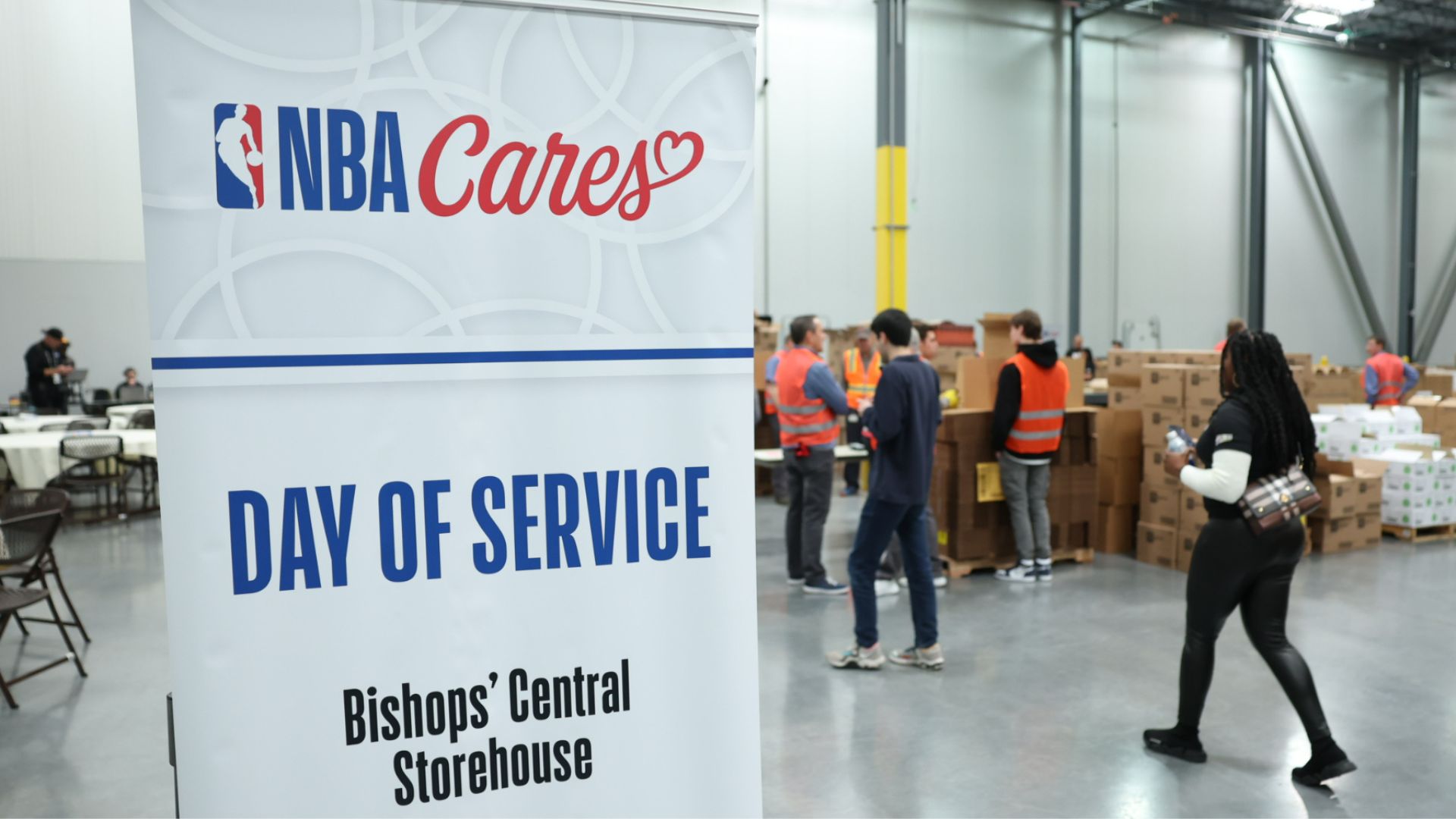 NBA All-Stars package food at Church's storehouse in Salt Lake