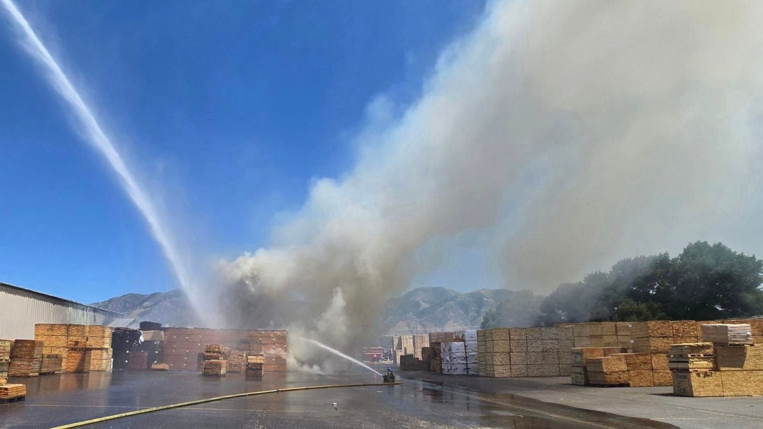 Firefighters protect structure from large pallet fire in Logan ...