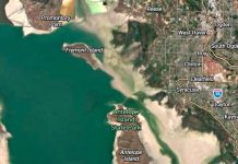 Satellite map showing Antelope Island State Park on the Great Salt Lake, with Promontory Point and Fremont Island to the northwest and Layton/Syracuse to the east, I-15 nearby.
