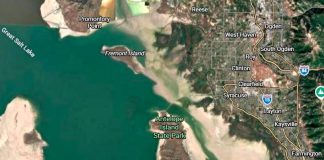 Satellite map showing Antelope Island State Park on the Great Salt Lake, with Promontory Point and Fremont Island to the northwest and Layton/Syracuse to the east, I-15 nearby.