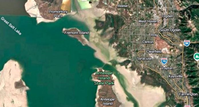 Satellite map showing Antelope Island State Park on the Great Salt Lake, with Promontory Point and Fremont Island to the northwest and Layton/Syracuse to the east, I-15 nearby.
