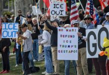 Hundreds rally yet again in weekend anti-ICE protest outside Utah Governor’s Mansion Crowd of protesters holding signs against ICE, including an 'ICE OUT' sign and an anti-war message with American flags in the background.