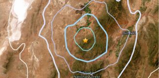 Map showing concentric colored contour rings with a central star, marking an epicenter near Fishlake National Forest south of Richfield.