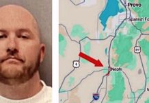 Mugshot of a bald man with a short beard looking straight at the camera.