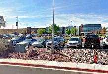 St. George PD finds no credible threat to 3 area schools Desert Hills shopping center parking lot with cars and a storefront sign in the foreground on a sunny day.ka?