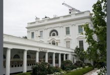 Gunshots heard near White House; suspect hospitalized White neoclassical building with a long colonnaded veranda, arched windows, and a garden in front.