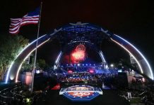 FBI says it disrupted plot to attack UFC 250 event at White House Nighttime outdoor concert under a large illuminated arch stage with fireworks, a cheering crowd, and an American flag waving on the left.