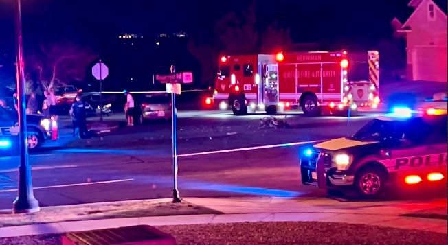 Herriman 5 | Gephardt Daily Nighttime street scene with police car and fire engine at an active incident, blue and red lights flashing.