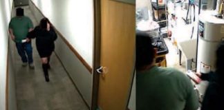 Two people walk down a hallway toward an open door on the left; a person in a green shirt works at a cluttered lab or kitchen counter on the right.