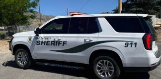 White sheriff patrol SUV parked outdoors, with 'TOOLE COUNTY SHERIFF' and 911 on the side and an orange light bar on top.
