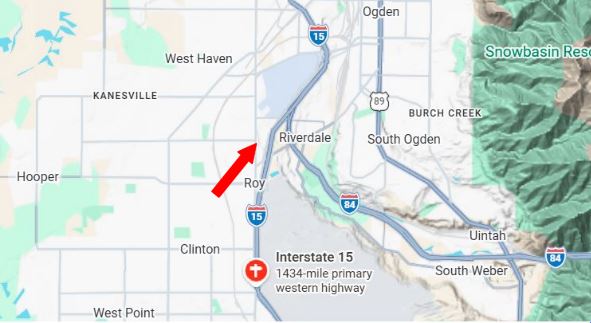 Map snippet showing a red arrow pointing northwest along Interstate 15 near Roy, Utah (Riverdale area) indicating route direction.