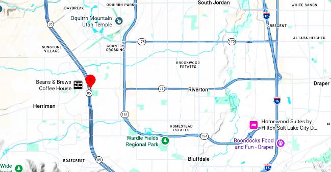 Map view with a red pin marking a location near Beans & Brews Coffee House, Draper, Utah (on a highway map).