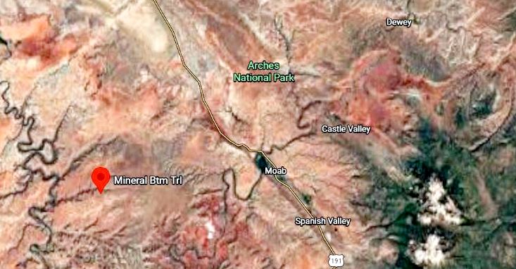 Satellite map of southeastern Utah around Moab, showing Arches National Park to the north, Castle Valley to the east, and a red pin labeled Mineral Bottom near the Moab area along a highway.