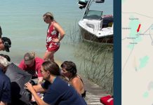 Left: group of people on a wooden dock by a light-blue lake, gathered around a dark bag near a white boat. Right: map area with a red arrow pointing to Delta.