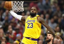 NBA great LeBron James to sign with Philadelphia 76ers, eyes 5th title LeBron James of the Los Angeles Lakers wearing #23 dunks toward the hoop during a crowded game.